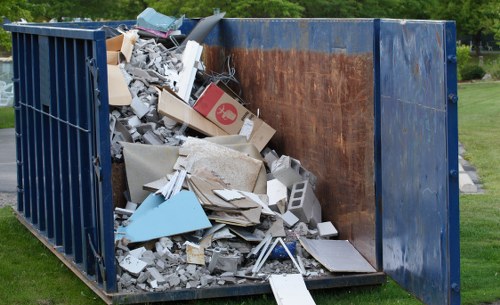 Office staff sorting materials into recycling streams during clearance